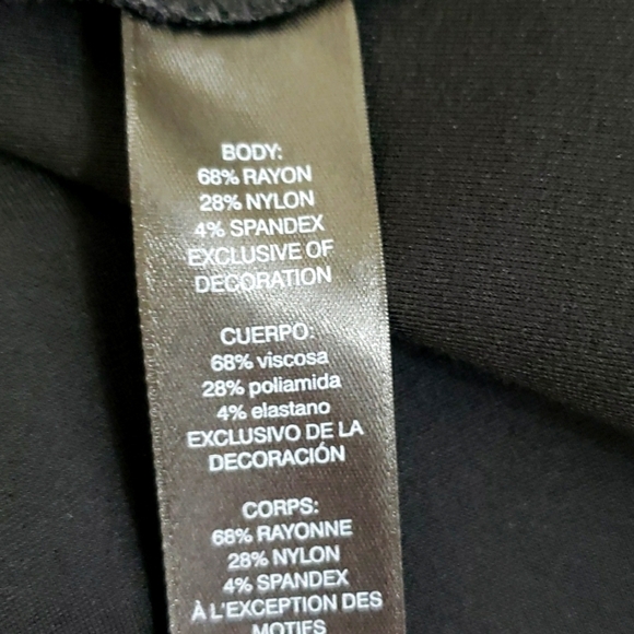 White Hause Black Market~Woman Size 0~Black Fit/Flare Lazer Cut Dress Pockets. - Picture 9 of 11